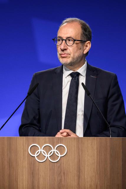 Director of the Organising Committee for the Alpes 2030 Winter Olympics Vincent Roberti speaks during an extraordinary session of the International Olympic Committee (IOC) in Lausanne on June 25, 2026. The roughly 100 members of IOC approved on June 25, 2026 the re-inclusion of ski mountaineering in the program for the Alpes 2030 Olympic Winter Games, which will take place in the French Alps, after the "additional sport" made its Olympic debut at Milan-Cortina in 2026. (Photo by Fabrice COFFRINI / AFP)