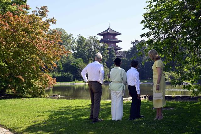 Japan's Emperor Naruhito (2nd R) and Japan's Empress Masako (2nd L) walk alongside King Philippe of Belgium (L) and Queen Mathilde of Belgium (R) during a visit to the Royal Greenhouses and the Japanese Tower in Brussels on June 25, 2026 as part of an official state visit of the Japanese Emperor and Empress to Belgium. (Photo by ERIC LALMAND / Belga / AFP) / Belgium OUT