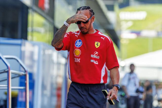 Ferrari's British driver Lewis Hamilton walks at the Red Bull Ring race track in Spielberg, Austria on June 25, 2026, ahead of the Formula One Austrian Grand Prix. (Photo by ERWIN SCHERIAU / APA / AFP) / Austria OUT