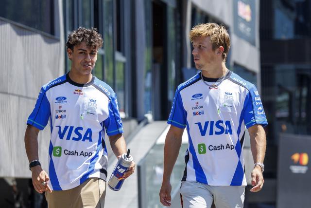 Racing Bulls' British driver Arvid Lindblad (L) and Racing Bulls' New Zealand driver Liam Lawson arrive at the Red Bull Ring race track in Spielberg, Austria on June 25, 2026, ahead of the Formula One Austrian Grand Prix. (Photo by ERWIN SCHERIAU / APA / AFP) / Austria OUT
