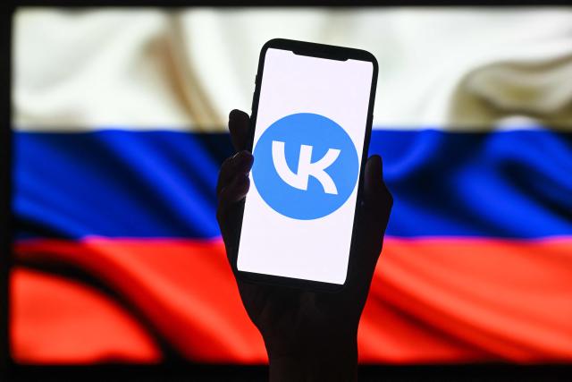 This illustration photograph shows the logo of Russian social media platform VK displayed on a smartphone in Moscow on June 25, 2026. Apple has removed VKontakte, one of Russia's largest social networks, from its App Store, the Russian company said on June 25, 2026, with the Kremlin calling for an explanation from the California-based tech giant. VKontakte (VK) was launched in 2006 as Russia's answer to Facebook and has since grown to become one of the most popular websites and social media platforms in the country. (Photo by Igor IVANKO / AFP)