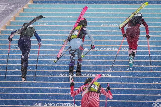 (FILES) (From L) France's Margot Ravinel, Slovakia's Marianna Jagercikova, Austria's Johanna Hiemer and Switzerland's Marianne Fatton compete in the women's sprint ski mountaineering heat 2 during the Milano Cortina 2026 Winter Olympic Games at the Stelvio Ski Centre in Bormio (Valtellina) on February 19, 2026. The International Olympic Committee, meeting in an extraordinary session, on June 25, 2026 approved adding ski mountaineering, which made its Olympic debut in Milan-Cortina this year, to the Alpes 2030 Olympic Winter Games program. (Photo by Dimitar DILKOFF / AFP)