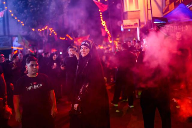 Shiite Muslims take part in the Ashura mourning ritual, which commemorates the killing of the Prophet Muhammad's grandson, Imam Hussein, in the Battle of Karbala in the seventh century, in Istanbul on June 25, 2026. (Photo by Yasin AKGUL / AFP)