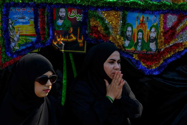 Shiite Muslims take part in the Ashura mourning ritual, which commemorates the killing of the Prophet Muhammad's grandson, Imam Hussein, in the Battle of Karbala in the seventh century, in Istanbul on June 25, 2026. (Photo by Yasin AKGUL / AFP)