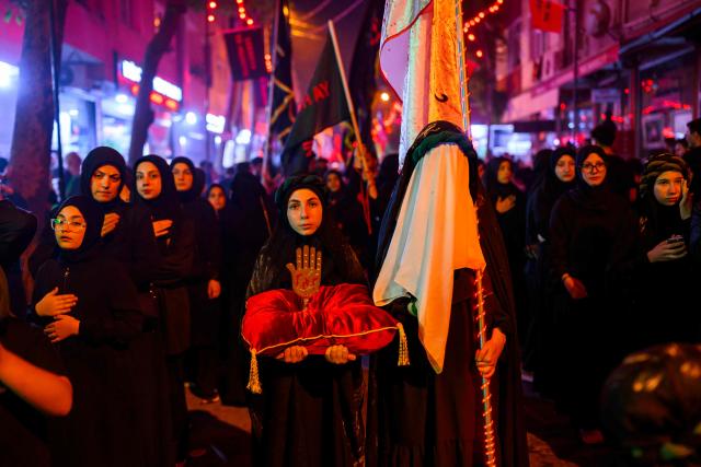 Shiite Muslims take part in the Ashura mourning ritual, which commemorates the killing of the Prophet Muhammad's grandson, Imam Hussein, in the Battle of Karbala in the seventh century, in Istanbul on June 25, 2026. (Photo by Yasin AKGUL / AFP)