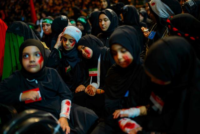 Shiite Muslims take part in the Ashura mourning ritual, which commemorates the killing of the Prophet Muhammad's grandson, Imam Hussein, in the Battle of Karbala in the seventh century, in Istanbul on June 25, 2026. (Photo by Yasin AKGUL / AFP)