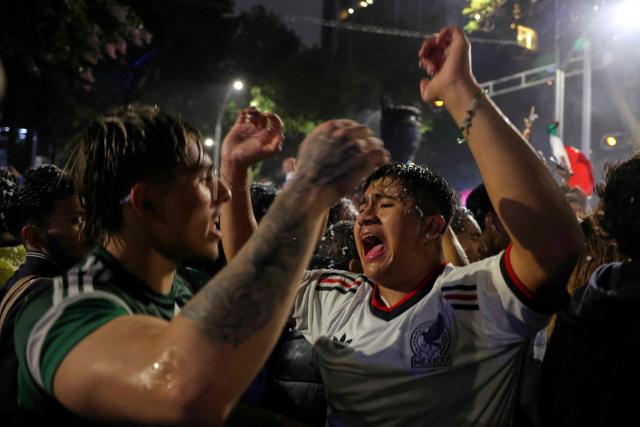 Mexican football fans celebrate their victory on a street in Mexico City on June 24, 2026, after the 2026 FIFA World Cup football match between Mexico and Czechia. (Photo by Claudia Rosel / AFP)