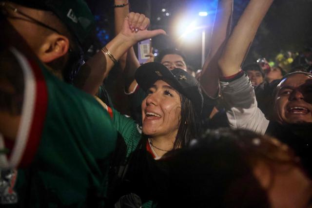 Mexican football fans celebrate their victory at the Angel de la Independencia in Mexico City on June 24, 2026, after the 2026 FIFA World Cup football match between Mexico and Czechia. (Photo by Claudia Rosel / AFP)