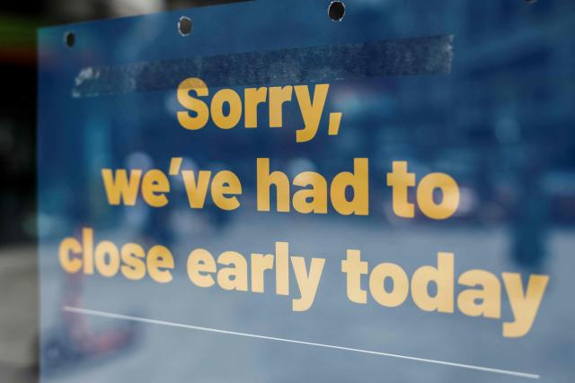 A sign in the window of popular British bakery chain Greggs is pictured informing customers of an early closure due to the heatwave, in central London on June 25, 2026. The UK's Met Office weather service on June 25 extended a red warning for extreme heat until late on June 26 for London and the surrounding area after temperatures hit record levels. (Photo by Brook Mitchell / AFP)