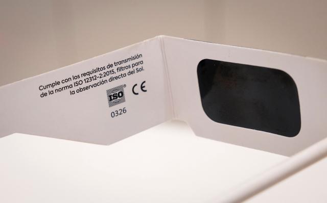 Eclipse viewing glasses certified with the ISO 12312-2:2015 international safety standard which specifies requirements for direct observation of the sun, are displayed at an optician's shop in Palma de Mallorca on June 25, 2026. According to Spain's National Astronomical Observatory, during the evening of Wednesday, August 12, 2026, a total solar eclipse will be visible from the Iberian Peninsula, marking the first such event in over a century. The path of totality of this eclipse will cross Spain from west to east and will pass throught numerous provincial capitals from La Coruna to Palma including Oviedo, Leon, Bilbao, Zaragoza, and Valencia. (Photo by Jaime REINA / AFP)