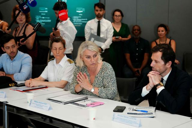 France's Health Minister Stephanie Rist (C) speaks next to Prefect of the Essonne department Fabienne Balussou (2ndL) and Frances junior Minister in charge of the environment Mathieu Lefevre (R) during a visit at the Paris-Saclay hospital in Orsay, southwest of Paris, on June 25, 2026 as a heatwave hits France. In Paris, 25 cardiac arrests were recorded "in twenty-four hours" on June 24, 2026, compared with "fewer than 10 usually," the office of France's Health Minister said on June 25, 2026. (Photo by Dimitar DILKOFF / AFP)