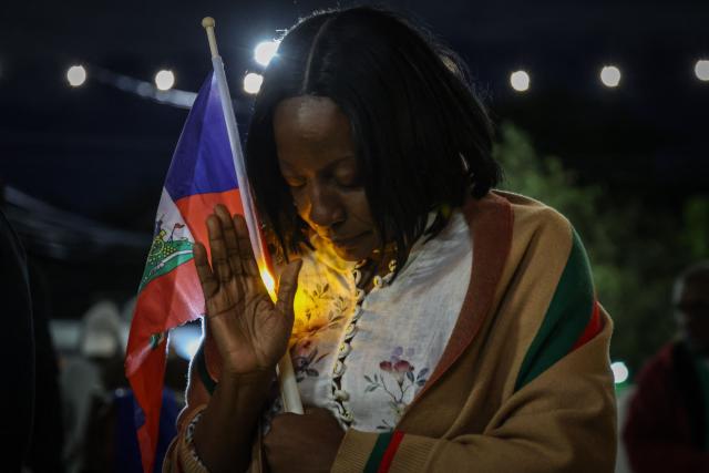 (FILES) A woman prays during a candlelight vigil for Haitians living in the US under the Temporary Protected Status (TPS) immigration program in Miami, Florida on February 3, 2026. The US Supreme Court on June 25, 2026, backed a Trump administration move to strip deportation protections from some 350,000 Haitians in the United States and 6,000 Syrians. The conservative-dominated court, in a 6-3 decision, said the Department of Homeland Security's decision to end Temporary Protected Status (TPS) for the Haitian and Syrian immigrants was not subject to judicial review. (Photo by Giorgio Viera / AFP)