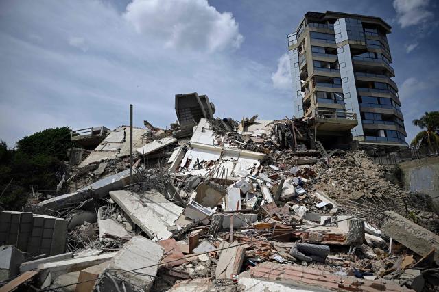 A view shows the rubble of a collapsed building following an earthquake in Catia La Mar, La Guaira state, about 30 km northwest of Caracas, on June 25, 2026. A twin earthquake that was Venezuela's largest in over a century has killed at least 164 people and destroyed multiple buildings near the capital, where residents searched on June 25 for missing relatives. (Photo by Federico PARRA / AFP)