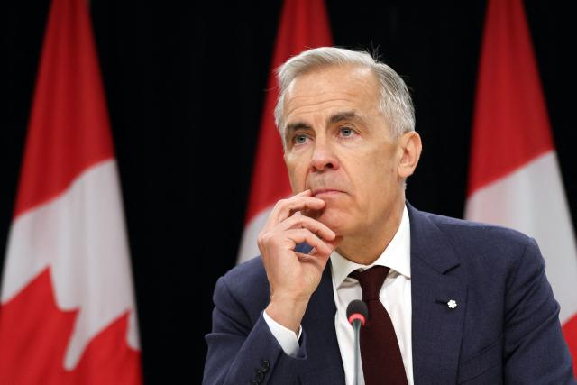 Canadian Prime Minister Mark Carney speaks during a news conference at the National Press Theatre in Ottawa, Canada on June 25, 2026. Carney is holding a wide-ranging news conference to mark last week's end to the parliamentary sitting. (Photo by Dave Chan / AFP)