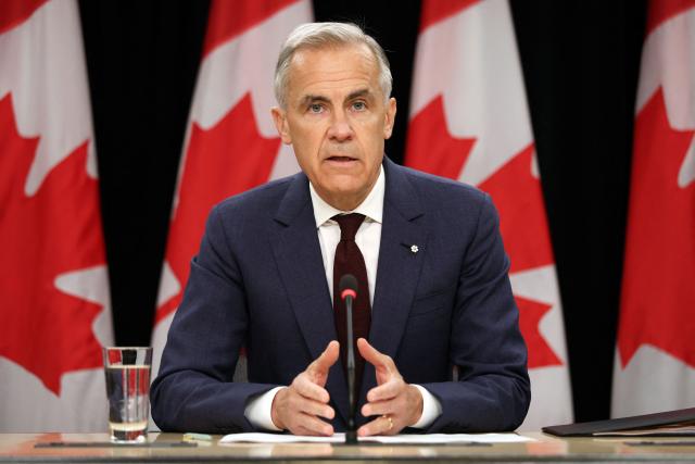 Canadian Prime Minister Mark Carney speaks during a news conference at the National Press Theatre in Ottawa, Canada on June 25, 2026. Carney is holding a wide-ranging news conference to mark last week's end to the parliamentary sitting. (Photo by Dave Chan / AFP)
