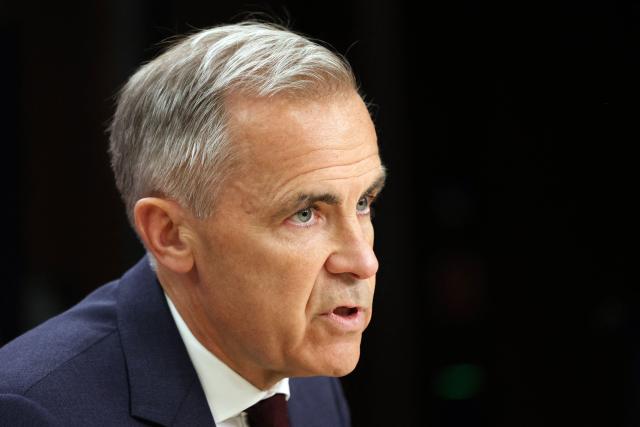 Canadian Prime Minister Mark Carney speaks during a news conference at the National Press Theatre in Ottawa, Canada on June 25, 2026. Carney is holding a wide-ranging news conference to mark last week's end to the parliamentary sitting. (Photo by Dave Chan / AFP)