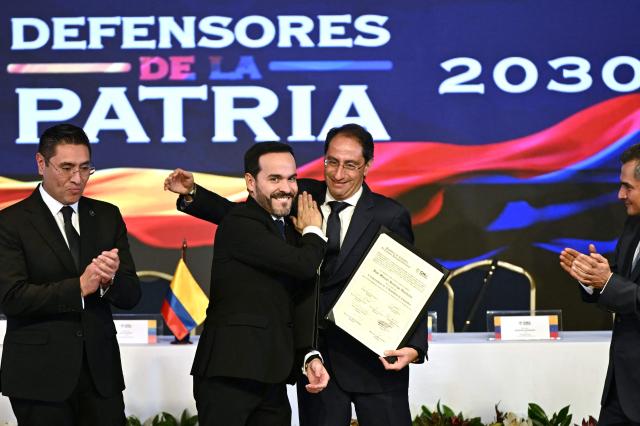Colombia’s President-elect Abelardo de la Espriella (2-L) and Vice President-elect Jose Manuel Restrepo (3-L) react after receiving their official credentials at the National Registry of Civil Status headquarters in Bogota on June 25, 2026.  (Photo by Luis ACOSTA / AFP)