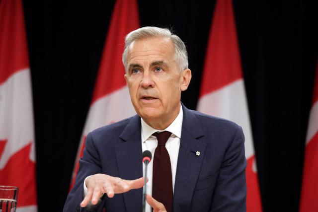 Canadian Prime Minister Mark Carney speaks during a news conference at the National Press Theatre in Ottawa, Canada on June 25, 2026. Carney is holding a wide-ranging news conference to mark last week's end to the parliamentary sitting. (Photo by Dave Chan / AFP)