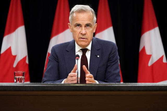 Canadian Prime Minister Mark Carney speaks during a news conference at the National Press Theatre in Ottawa, Canada on June 25, 2026. Carney is holding a wide-ranging news conference to mark last week's end to the parliamentary sitting. (Photo by Dave Chan / AFP)