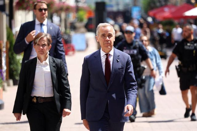 Canadian Prime Minister Mark Carney arrives for a news conference in Ottawa, Canada on June 25, 2026. Carney is holding a wide-ranging news conference to mark last week's end to the parliamentary sitting. (Photo by Dave Chan / AFP)