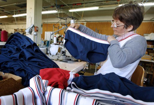 (FILES) POUR ILLUSTRER LE PAPIER : "LE SLIP FRANCAIS SURFE SUR LA PRESIDENTIELLE ET LE +MADE IN FRANCE+" -A worker looks at a Le Slip Francais men's underwear at the "Moulin Neuf" textile company in Saint-Antoine-Cumond, southwestern France on March 27, 2012. The company Le Slip Francais manufactures men's underwears 100 % "made in France" and diverts the campaign posters for the 2012 French presidential election to promote its products.  AFP PHOTO /PHOTO PATRICK BERNARD. The underwear brand Le Slip français, one of the leaders of the "made in France" movement, announced on June 25, 2026 that it will go public on the symbolic date of July 14, hoping to raise 5 million euros in fresh capital. (Photo by Patrick BERNARD / AFP)