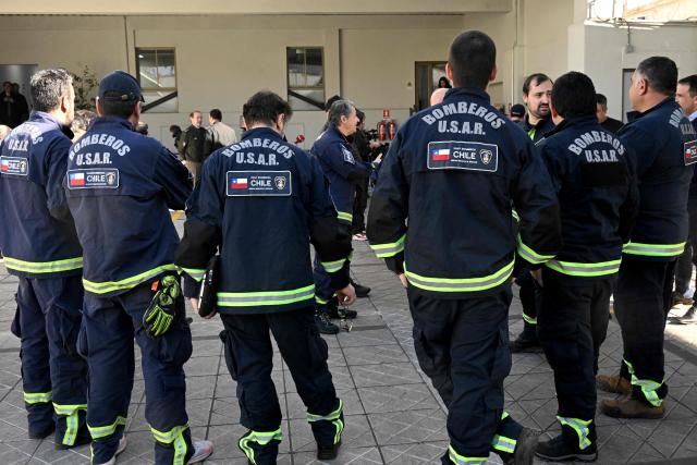 Chile's USAR search and rescue team prepares to deploy to Venezuela at the National Firefighters Board headquarters in Santiago on June 25, 2026, after two powerful earthquakes left at least 164 dead and hundreds injured. An international outpouring of aid quickly followed the tremors on June 24 evening, which the United States Geological Survey measured as magnitude 7.2 and 7.5, centered west of the capital Caracas. (Photo by RODRIGO ARANGUA / AFP)