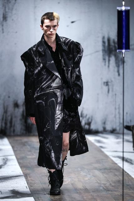 A model presents a creation by Yohji Yamamoto for the Menswear Spring/Summer 2027 collection fashion show as part of the Paris Fashion Week, in Paris, on June 25, 2026. (Photo by SIMON WOHLFAHRT / AFP)