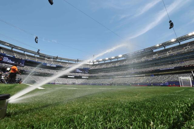 A photo shows sprinklers watering the pitch prior to the 2026 World Cup Group E football match between Ecuador and Germany at the New York/New Jersey Stadium in East Rutherford on June 25, 2026. (Photo by CHARLY TRIBALLEAU / AFP)