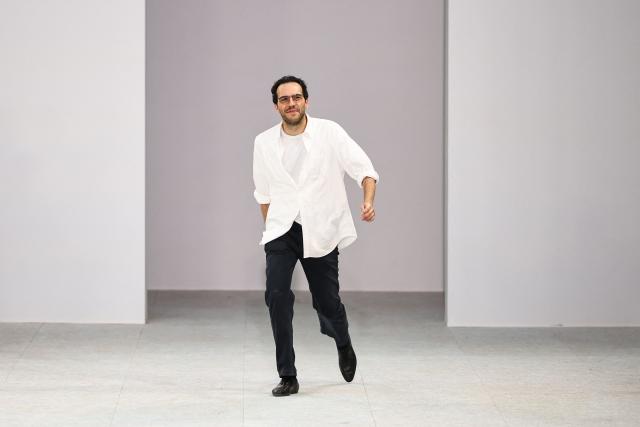 Belgian fashion designer Julian Klausner acknowledges the audience at the end of the Dries Van Noten Menswear Spring/Summer 2027 collection fashion show as part of the Paris Fashion Week, in Paris, on June 25, 2026. (Photo by SIMON WOHLFAHRT / AFP)