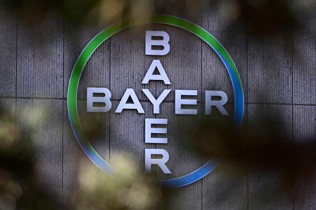 (FILES) The company logo of German chemical giant Bayer is pictured at the company's site in Berlin on March 4, 2026. The US Supreme Court sided with multinational giant Bayer on June 25, 2026, overturning a lower court ruling that exposed the company to thousands of claims that the Monsanto weedkiller Roundup causes cancer. In a 7-2 decision, the US high court sent back to a Missouri state court a $1.25 million jury award against the Germany-based company, concluding that the US Environmental Protection Agency's determination that Roundup is not a carcinogen preempts state labelling requirements. (Photo by Tobias SCHWARZ / AFP)