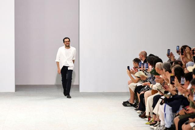 Belgian fashion designer Julian Klausner acknowledges the audience at the end of the Dries Van Noten Menswear Spring/Summer 2027 collection fashion show as part of the Paris Fashion Week, in Paris, on June 25, 2026. (Photo by SIMON WOHLFAHRT / AFP)