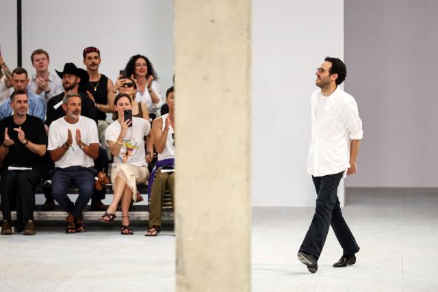 Belgian fashion designer Julian Klausner acknowledges the audience at the end of the Dries Van Noten Menswear Spring/Summer 2027 collection fashion show as part of the Paris Fashion Week, in Paris, on June 25, 2026. (Photo by SIMON WOHLFAHRT / AFP)
