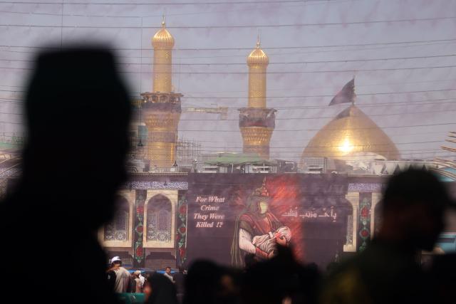 Shia Muslim devotees attend a mourning ritual in Iraq's holy city of Karbala on June 25, 2026, at the peak of Ashura, a 10-day period commemorating the seventh century killing of Prophet Mohammed's grandson Imam Hussein. (Photo by AHMAD AL-RUBAYE / AFP)