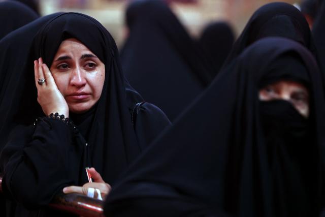 Shia Muslim devotees take part in a mourning procession in Iraq's holy city of Karbala on June 25, 2026, at the peak of Ashura, a 10-day period commemorating the seventh century killing of Prophet Mohammed's grandson Imam Hussein. (Photo by AHMAD AL-RUBAYE / AFP)