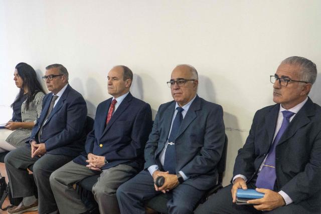 (FILES) Former Navy commanders (L-R) Luis Enrique Lopez Mazzeo (Former Commander of Naval Training and Recruitment), Claudio Javier Villamide (Former Chief of the Submarine Force Command), Hector Alonso (Former Chief of Operations of the Submarine Force) and Hugo Miguel Correa (Former Head of Maintenance and Arsenals) attend their trial on the sinking of the ARA San Juan submarine on November 15, 2017 where 44 members of the Argentine Navy died, in Rio Gallegos, Santa Cruz, Argentina on March 3, 2026. The defense team for one of the former Argentine officers accused in connection with the 2017 submarine explosion requested his acquittal on June 25, 2026, arguing that there is no evidence that his actions led to the deaths of the 44 crew members. (Photo by WALTER DIAZ / AFP)