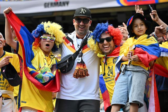 A German fan alongside Ecuadorian fans pose for a picture ahead of the 2026 World Cup Group E football match between Ecuador and Germany at the New York/New Jersey Stadium in East Rutherford on June 25, 2026. (Photo by ANGELA WEISS / AFP)