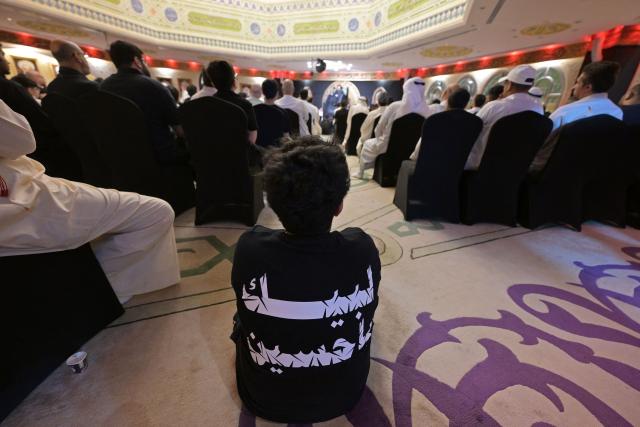 Shiite Muslim devotees attend a ceremony to commemorate Ashura at the Al-Awhad Husseiniya, in Kuwait City on June 25, 2026. The commemoration of Ashura consists of a ten-day mourning period starting on the first day of Muharram according to the Islamic calendar, marking the seventh-century slaying of Prophet Mohammed's grandson Imam Hussein. (Photo by YASSER AL-ZAYYAT / AFP)