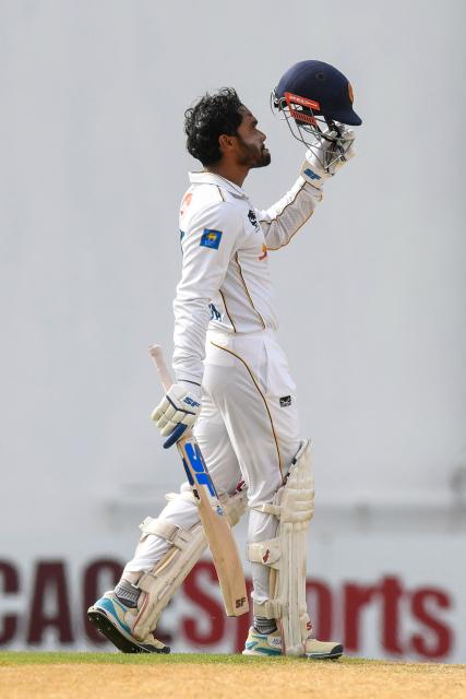 Dhananjaya de Silva of Sri Lanka celebrates his century during the first day of the first Test cricket match between West Indies and Sri Lanka at Sir Vivian Richards Stadium in North Sound, Antigua and Barbuda, on June 25, 2026. (Photo by Randy Brooks / AFP)