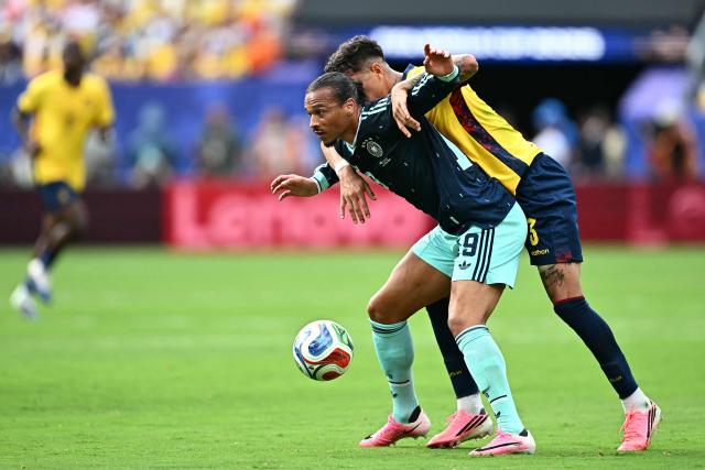 Germany's forward #19 Leroy Sane and Ecuador's defender #03 Piero Hincapie fight for the ball during the 2026 World Cup Group E football match between Ecuador and Germany at the New York/New Jersey Stadium in East Rutherford on June 25, 2026. (Photo by Jewel SAMAD / AFP)
