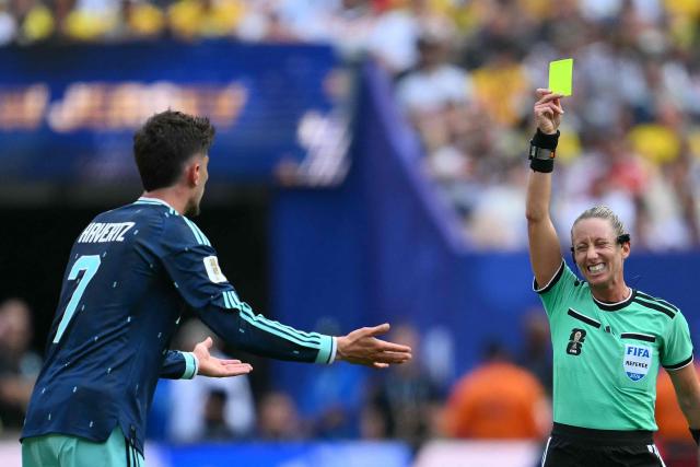 US referee Tori Penso shows a yellow card to Germany's forward #07 Kai Havertz during the 2026 World Cup Group E football match between Ecuador and Germany at the New York/New Jersey Stadium in East Rutherford on June 25, 2026. (Photo by ANGELA WEISS / AFP)