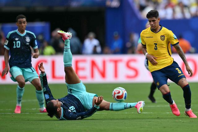Germany's forward #19 Leroy Sane falls next to Ecuador's defender #03 Piero Hincapie during the 2026 World Cup Group E football match between Ecuador and Germany at the New York/New Jersey Stadium in East Rutherford on June 25, 2026. (Photo by ANGELA WEISS / AFP)