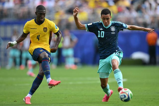 Ecuador's defender #04 Joel Ordonez and Germany's midfielder #10 Jamal Musiala fight for the ball during the 2026 World Cup Group E football match between Ecuador and Germany at the New York/New Jersey Stadium in East Rutherford on June 25, 2026. (Photo by ANGELA WEISS / AFP)