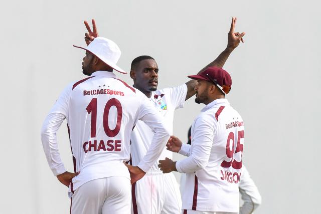Justin Greaves (C) of West Indies celebrates the dismissal of Dhananjaya de Silva of Sri Lanka during the first day of the first Test cricket match between West Indies and Sri Lanka at Sir Vivian Richards Stadium in North Sound, Antigua and Barbuda, on June 25, 2026. (Photo by Randy Brooks / AFP)