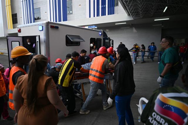 A victim of the twin earthquake is admitted at the Domingo Luciani hospital in Caracas, on June 25, 2026. The death toll from twin quakes, measured at magnitudes 7.2 and 7.5, has risen to at least 188, with more than 1,520 others injured, top lawmaker Jorge Rodriguez reported, while residents continue searching for missing relatives. (Photo by Juan BARRETO / AFP)