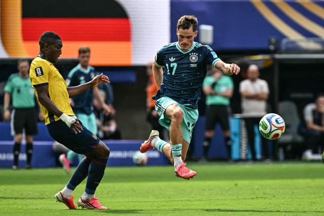 Germany's midfielder #17 Florian Wirtz controls the ball past Ecuador's defender #04 Joel Ordonez during the 2026 World Cup Group E football match between Ecuador and Germany at the New York/New Jersey Stadium in East Rutherford on June 25, 2026. (Photo by Jewel SAMAD / AFP)