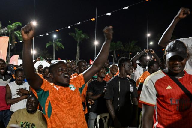 Ivory Coast's National Football team supporters react as they watch the 2026 FIFA World Cup football tournament match between Ivory Coast and Curacao at the Place de la Mairie in Abobo, suburb of Abidjan on June 25, 2026. (Photo by Issouf SANOGO / AFP)