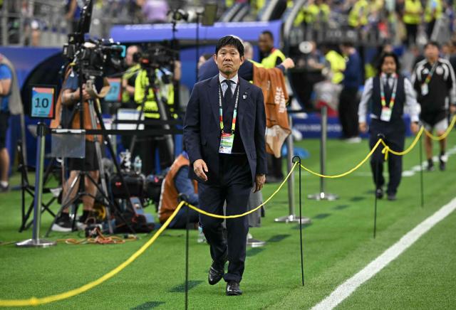 Japan's head coach Hajime Moriyasu walks on the pich ahead of the 2026 World Cup Group F football match between Japan and Sweden at the Dallas Stadium in Arlington on June 25, 2026. (Photo by Paul ELLIS / AFP)