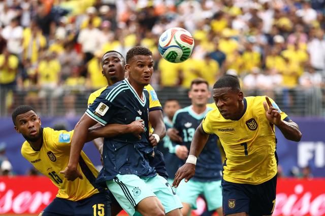 Germany's defender #04 Jonathan Tah and Ecuador's defender #07 Pervis Estupinan fight for the ball during the 2026 World Cup Group E football match between Ecuador and Germany at the New York/New Jersey Stadium in East Rutherford on June 25, 2026. (Photo by CHARLY TRIBALLEAU / AFP)
