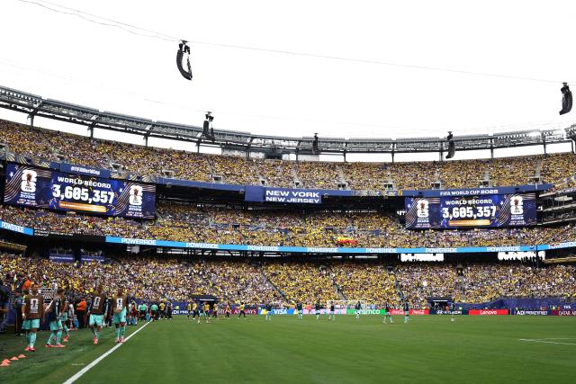 Screens show the total attendance at the 2026 World Cup marking a world record during the 2026 World Cup Group E football match between Ecuador and Germany at the New York/New Jersey Stadium in East Rutherford on June 25, 2026. (Photo by CHARLY TRIBALLEAU / AFP)