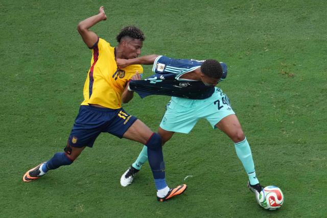 Ecuador's forward #11 Kevin Rodriguez and Germany's defender #24 Malick Thiaw fight for the ball during the 2026 World Cup Group E football match between Ecuador and Germany at the New York/New Jersey Stadium in East Rutherford on June 25, 2026. (Photo by TIMOTHY A. CLARY / AFP)